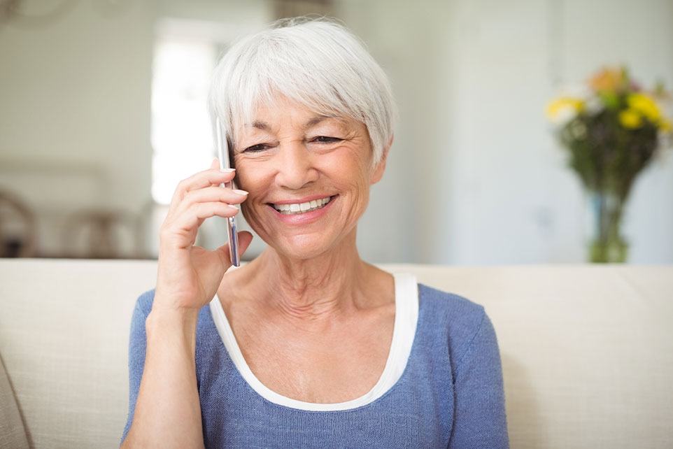 Elderly Woman getting her inquiring about her account balance.