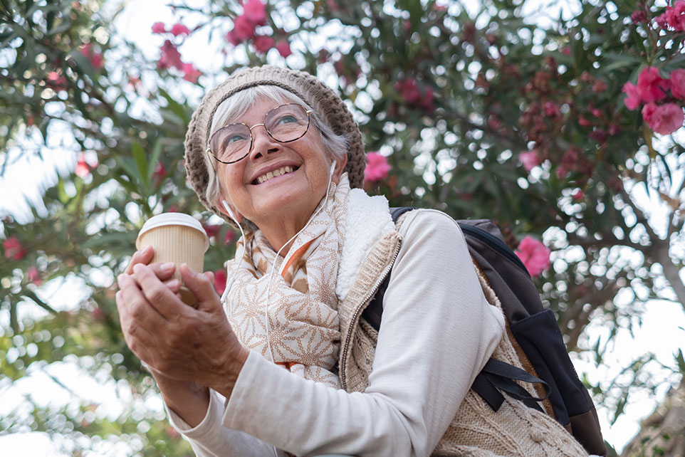 Woman drinking coffee on a walk.