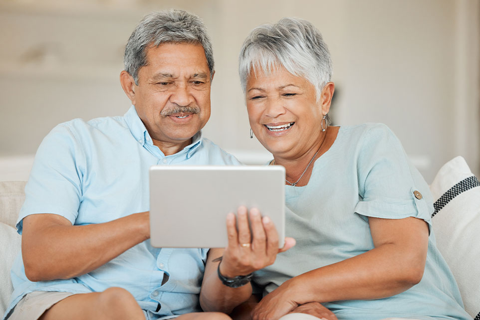 Eldery couple reviewing their banking accounts.