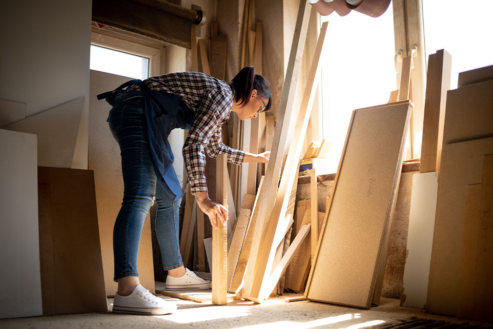 Young adult making repairs to their home.