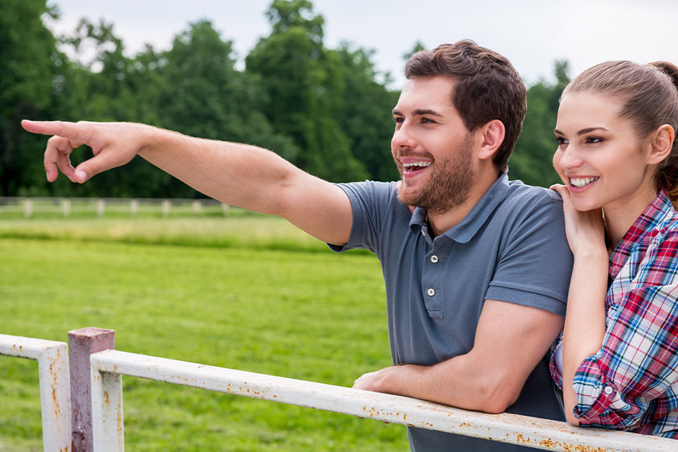 A couple looking at lots for a new home to be built on.